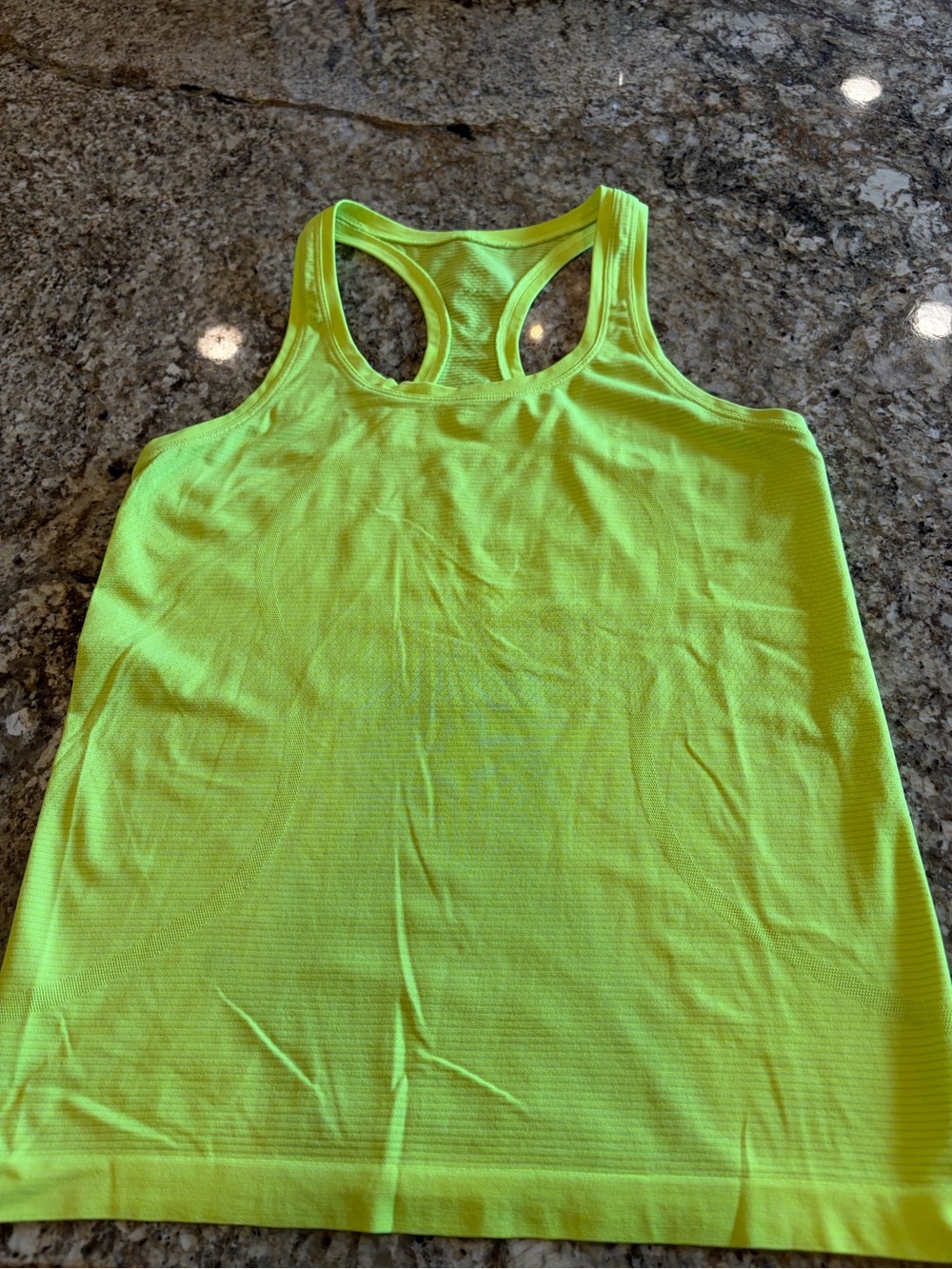 lululemon athletica Neon Yellow Racerback Tank
Swiftly hip length